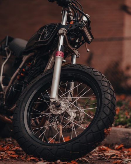 a motorcycle parked in front of a brick building